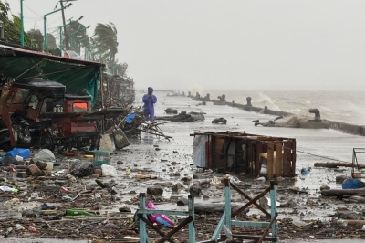 Marcos Jr orders full alert as Super Typhoon Ragasa lashes northern Philippines A man stands near debris on a waterfront road amid heavy rain due to weather patterns from Super Typhoon Ragasa in Aparri town, Cagayan province September 22, 2025. Hundreds of families sheltered in schools and evacuation centres today as heavy rains and gale-force winds from Super Typhoon Ragasa lashed the northern Philippines and southern Taiwan. — AFP pic