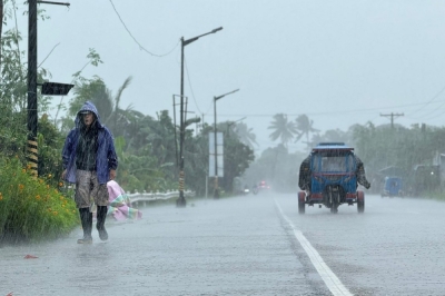 Super Typhoon Ragasa makes landfall in northern Philippines as East Asia braces for impact, China prepares to evacuate 400,000 A man walks along a road amid heavy rain due to weather patterns from Super Typhoon Ragasa in Lal-lo town, Cagayan province on September 22, 2025. — AFP pic
