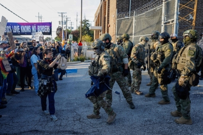 Is the American dream slipping away? Indian grads stunned by US$100,000 visa fee Law enforcement officers face pro-immigration demonstrators during a protest outside an ICE processing center in Broadview, Illinois, on September 19, 2025. — AFP pic