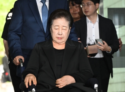 Luxury gifts, bribes and a former first lady: Unification Church leader arrested in South Korea Unification Church leader Han Hak-ja arrives on a wheelchair to attend a hearing to review her arrest warrant requested by special prosecutors at the Seoul Central District Court in Seoul September 22, 2025. — AFP pic