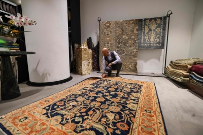 Sanctions, shifting tastes leave Iran’s famed carpet industry hanging by a thread An Iranian man checks a rug at a shop selling antique and expensive carpets in northern Tehran on September 9, 2025. Once a symbol of unmatched artistry and cultural prestige, Iran’s handmade rugs are being unwoven from the global tapestry due to international sanctions and domestic pressures. — AFP pic