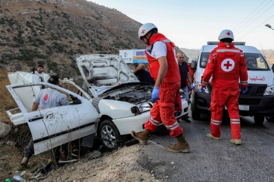 One year since Israel war: Hezbollah battered on battlefield but cash keeps flowing First responders and security forces’ members gather at the site of an Israeli strike on a vehicle on the Khardali road in south Lebanon’s Marjayoun area on September 20, 2025. — AFP pic