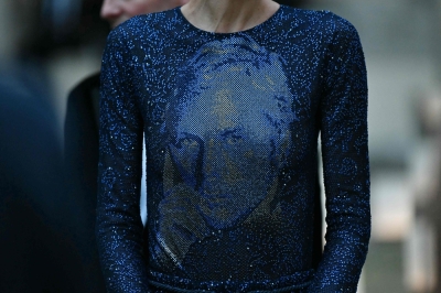 Cate Blanchett, Richard Gere among stars honouring Armani’s final Milan show A model wearing an outfit with a portrait of Giorgio Armani is pictured before the Giorgio Armani collection show at Milan's Fashion Week Womenswear Spring/Summer 2026, at the Pinacoteca di Brera Museum on September 28, 2025 in Milan. — AFP pic