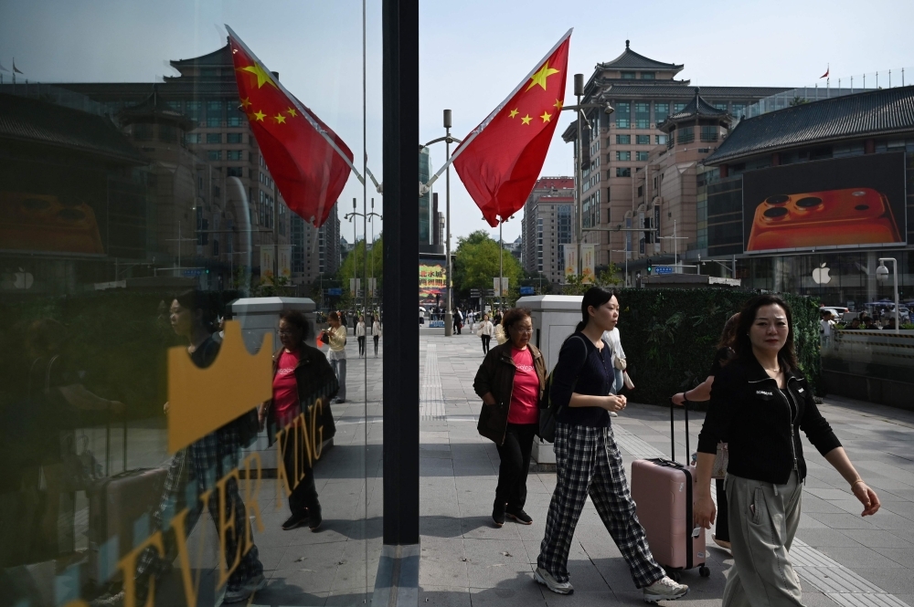 ‘China isn’t afraid’: Beijingers unfazed by Trump’s 100pc tariff warning