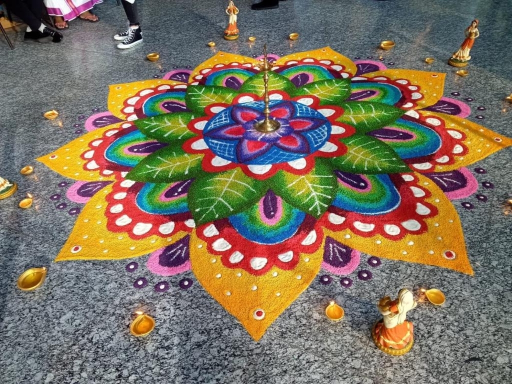 Why the making of a ‘kolam’ still matters despite modern shortcuts Mehnaga’s ‘kolam’ for Maybank’s Deepavali shoot is packed with vibrant colours. — Picture courtesy of Mehnaga Mathivanan