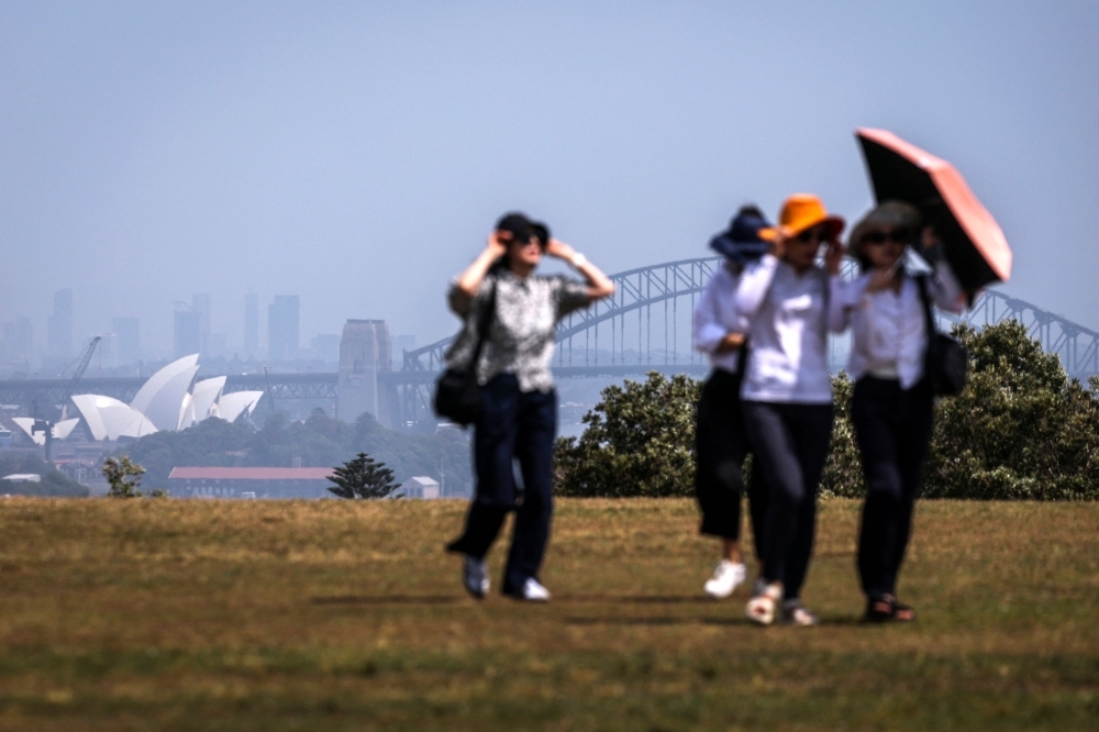 Record heat and gale-force winds fuel wildfires across Australia, New Zealand