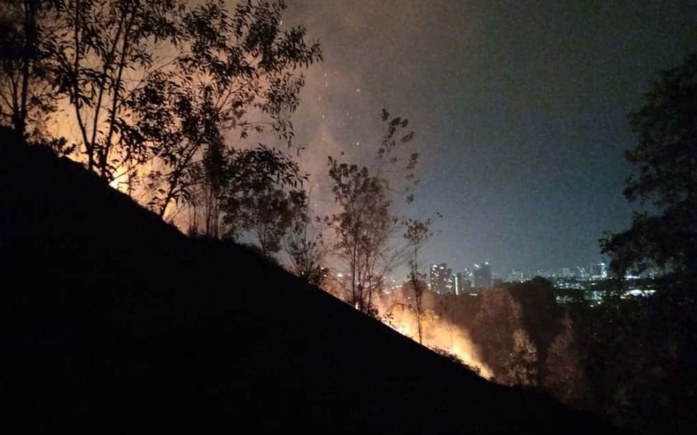 Balakong forest fire fully put out after five-hour battle, 2.4ha burned Firefighters extinguished a 2.4-hectare forest fire in the hilly area of Taman Seri Timah, Balakong, after more than five hours of operations overnight. — Picture courtesy of Selangor Fire and Rescue Department