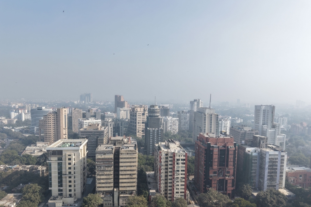 An aerial view shows buildings engulfed in dense smog in New Delhi on December 3, 2025. — AFP pic