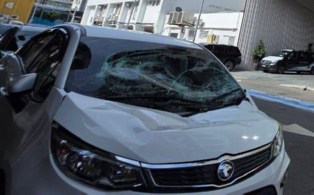 Chinese tourist dies after fall from ninth floor of Kota Kinabalu hotel, police investigating The damaged car following the incident. — The Borneo Post pic