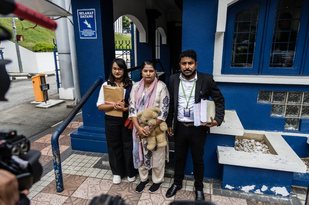 Indira Gandhi’s latest meeting with IGP over missing daughter ultimately disappointing, Arun calls police response ‘non-substantive’ Indiraq Gandhi (centre) and Indira Gandhi Action Team (Ingat) chairman Arun Dorasamy (right) are seen before the meeting with IGP Tan Sri Mohd Khalid Ismail at the Bukit Aman police headquarters in Kuala Lumpur December 10, 2025. — Picture by Firdaus Latif