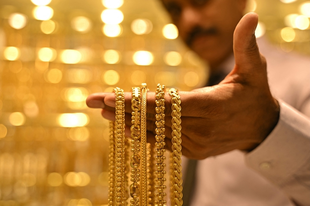 As gold prices climb, many Malaysian families find a hidden financial cushion Gold jewellery and small savings, long held by Malaysian families as a form of financial protection, have gained new significance as rising prices quietly strengthen household balance sheets and offer a buffer against the cost-of-living squeeze. — AFP pic