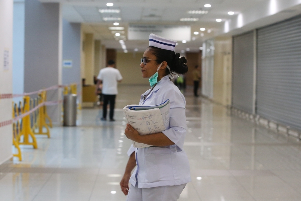 Is your medical insurance too expensive? Why the government’s new base MHIT alternative changes everything The Malaysian government will require insurers to provide a basic medical insurance policy to cover essential and high-impact treatment at private hospitals and protect Malaysians from health-related financial shocks, with this plan aimed at being more affordable. — Picture by Yusof Mat Isa