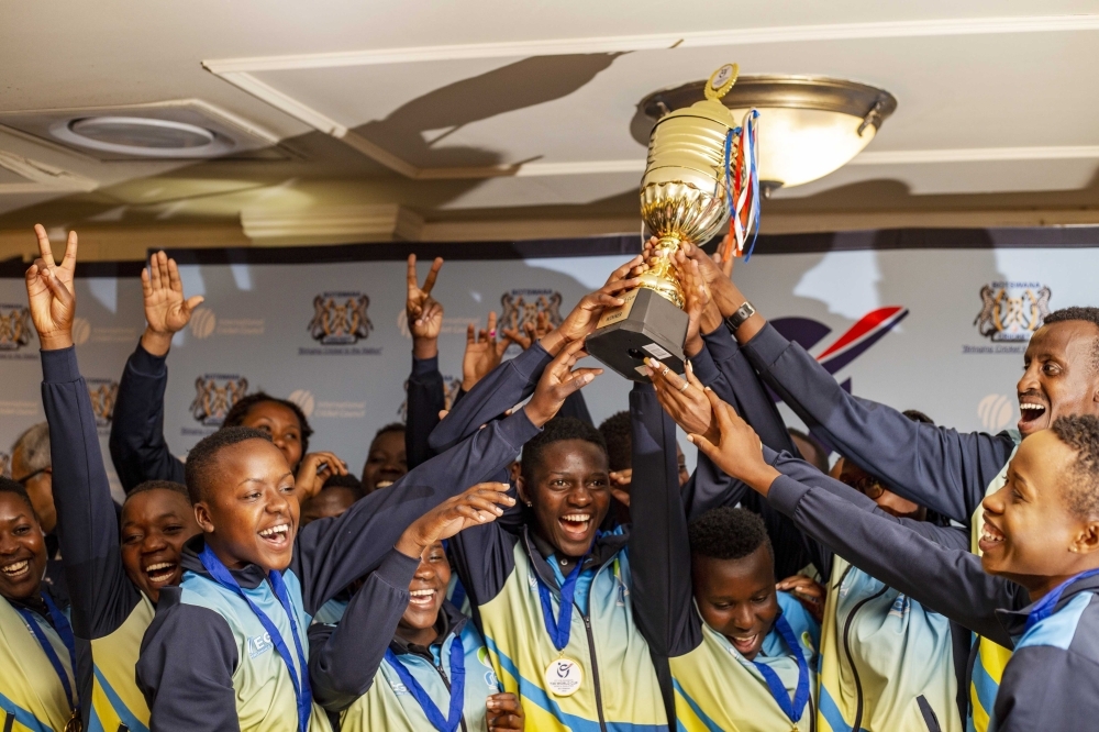 The national U-19 women cricket players hoist the trophy as they celebrate defeating Tanzania by 6 wickets on Monday, September 12 to qualify
for the 2023 women cricket World Cup that will be held in South Africa. Photo: Courtesy.