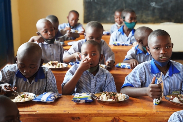Students during lunch time at Groupe Scolaire Ayabaraya in Kicukiro District on February 28. Educationists have expressed concern that the funding towards students’ meals is too small after the parents’ contribution was slashed to just Rwf975 per term despite the rise in commodity prices. Photo: Craish Bahizi. 