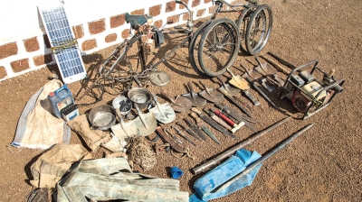 Machetes, knives, spades, and other equipment confiscated from poachers are laid out at Chinko's headquarters. Poacher units are often armed by wealthy businessmen who bankroll the operations and profit from the kill. Net photo.