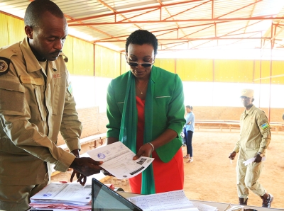 Ingabire is handed her release papers by an officer from Rwanda Correctional  Service at Nyarugenge Prison last Saturday (Sam Ngendahimana)