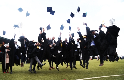 University of Rwanda graduates celebrate at Huye Stadium in 2018. 