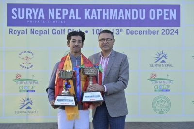 Surya Nepal Pvt Ltd Brand Manager Bidur Raj Adhikari (right) handing over the trophies to Nepal No 1 amateur golfer Sadbhav Acharya after the Surya Nepal Kathmandu Open at the Royal Nepal Golf Club in Kathmandu on Friday. Naresh Shrestha / THT