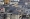 دخان يتصاعد فوق المباني في مخيم عين الحلوة للاجئين الفلسطينيين بمدينة صيدا الساحلية «أ.ف.ب»
