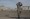 مقاتل أرمني يراقب منطقة اشتباك في ناغورني كاراباخ  (رويترز)