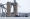 قوارب الطوارئ تعمل بالقرب من الجزء المنهار من جسر فرانسيس سكوت كي، بعد اصطدام سفينة الشحن دالي به، في بالتيمور، ماريلاند، الولايات المتحدة، 27 مارس 2024. «رويترز»