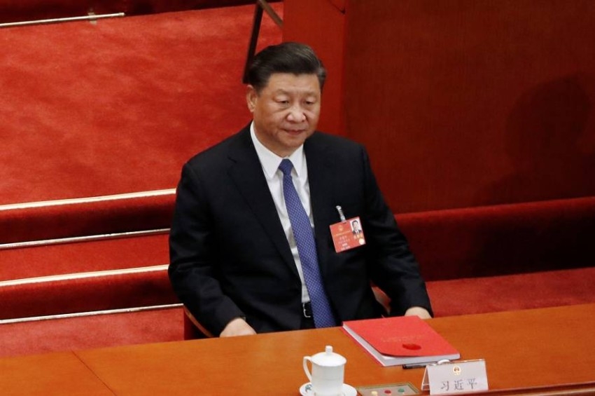 رئيس الصين يتعهد لميركل بالانفتاح والتعاون مع العالم