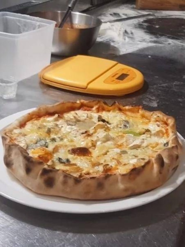 بيتزا بـ254 نوعاً من الجبن في «غينيس»
