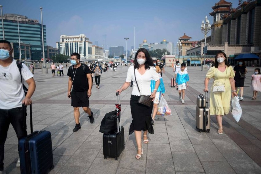 بكين تشدد القيود على سفر مواطنيها إلى الخارج