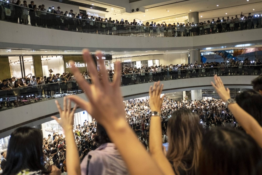 Demonstrators sing the "Glory To Be Thee, Hong Kong" protest song during a flash mob in 2019. 