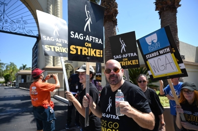 Members of the Writers Guild of America and the Screen Actors Guild take part in a picket line outside Paramount Studios in Hollywood, California, on Thursday. 