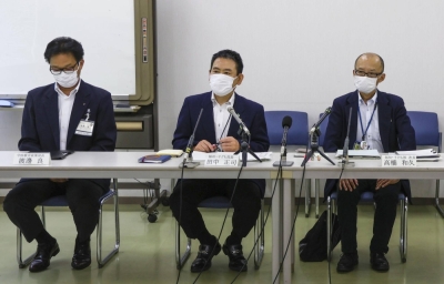 Officials in the municipality of Daito, in Osaka, speak at a news conference on Wednesday regarding a case in which a mother is suspected of starving her daughter, hospitalizing her and claiming insurance payments.