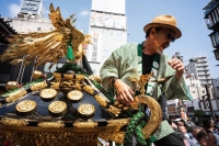 A man stands atop a float holding a portable shrine at this year’s Sanja Festival in Tokyo. | JOHAN BROOKS