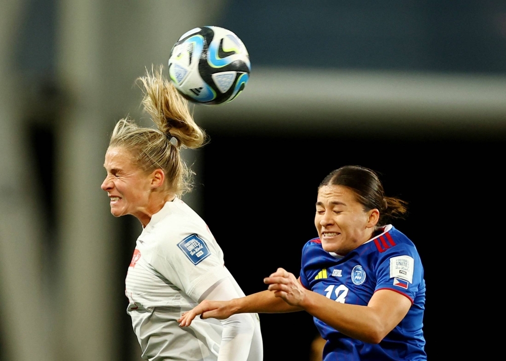 Switzerland's Ana-Maria Crnogorcevic (left) and the Philippines' Angela Beard vie for the ball during their match at the Women's World Cup in Dunedin, New Zealand, on Friday. Switzerland won 2-0.