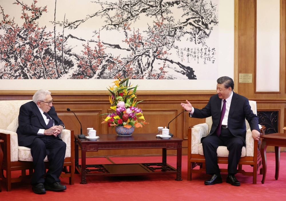 Chinese President Xi Jinping and Henry Kissinger, former U.S. secretary of state, attend a meeting at the Diaoyutai State Guesthouse in Beijing on Thursday.