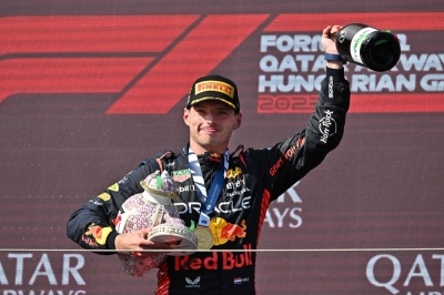 Max Verstappen leaves the podium with his broken trophy after the Formula One Hungarian Grand Prix in Mogyorod, Hungary, on Sunday.
