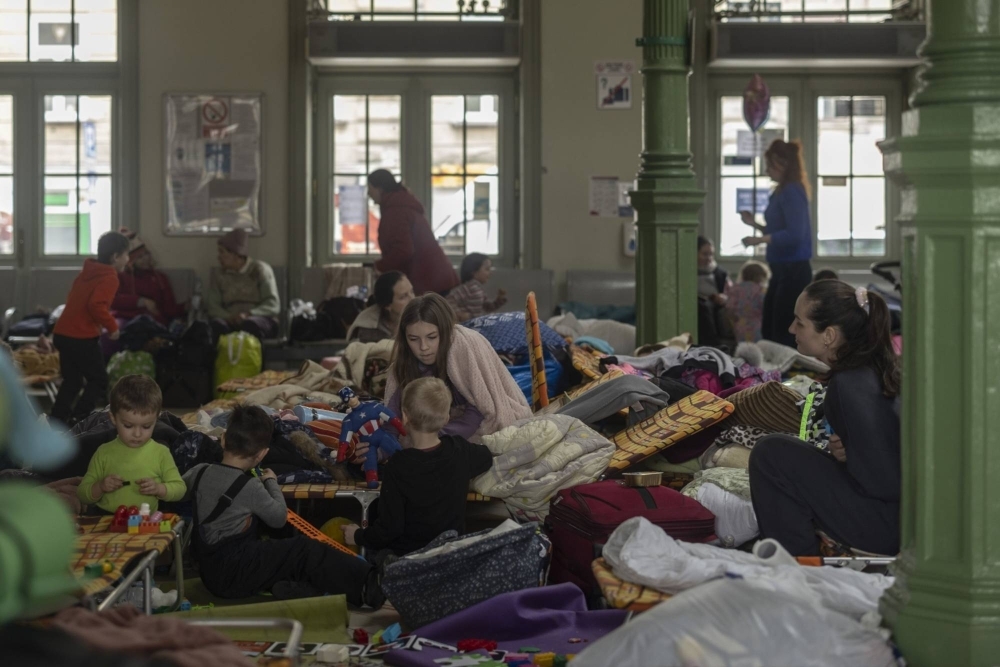 Women and children fleeing Ukraine gather in Przemysl train station on March 2, 2022. 