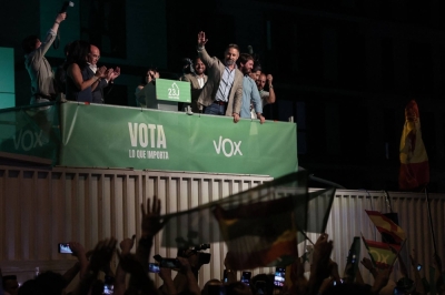 Spanish far-right Vox party leader Santiago Abascal (center) greets supporters as he arrives to deliver a speech at the party headquarters in Madrid on Sunday after Spain's general election.