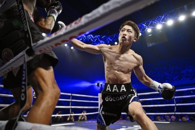 Naoya Inoue attacks Stephen Fulton during their super bantamweight title bout at Ariake Arena on Tuesday.
