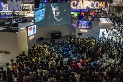 Attendees gather in front of a stage at the Capcom booth during the Tokyo Game Show in Chiba in 2018.