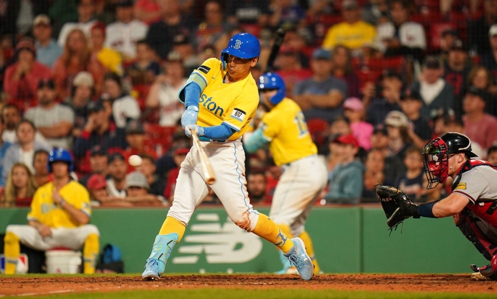 Masataka Yoshida hits a two-run home run against the Braves in Boston on Tuesday.