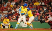 Masataka Yoshida hits a two-run home run against the Braves in Boston on Tuesday. | USA Today / via Reuters