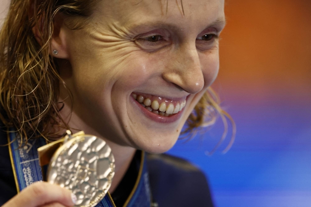 Katie Ledecky celebrates with her gold medal after winning the women's 1,500-meter freestyle final at the World Aquatics Championships in Fukuoka on Tuesday.
