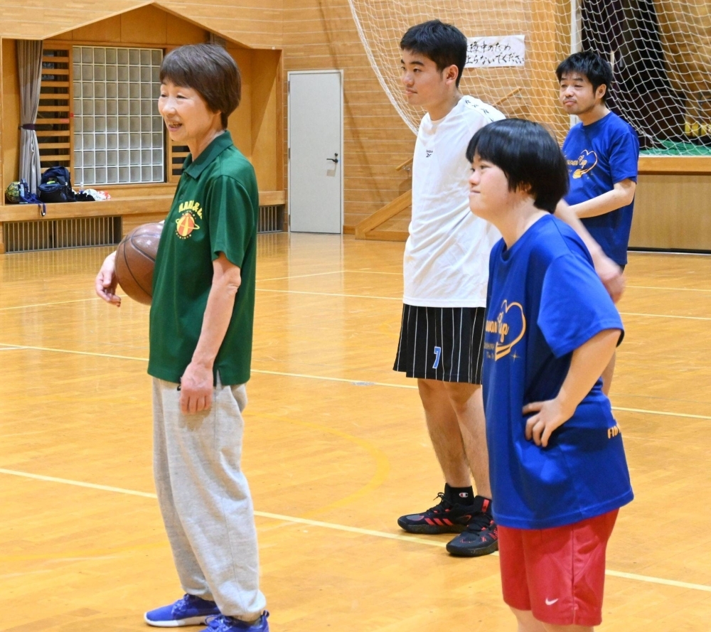 Yoshiko Hara (left) plays basketball with members of her Fukushima Club basketball team.