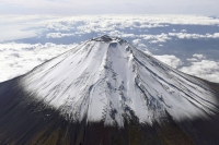Photo: Mount Fuji is shot from above so that you can see the trails leading to its summit. | KYODO
