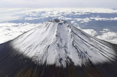 Photo: Mount Fuji is shot from above so that you can see the trails leading to its summit.