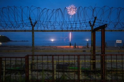 Lighting fireworks on Myeongpa Beach, where families can camp near the DMZ border, in Goseong-gun, South Korea, on July 30, 2022. ​In recent years, northern counties of South Korea have become unlikely tourist destinations, attracting people drawn to the history of the DMZ.