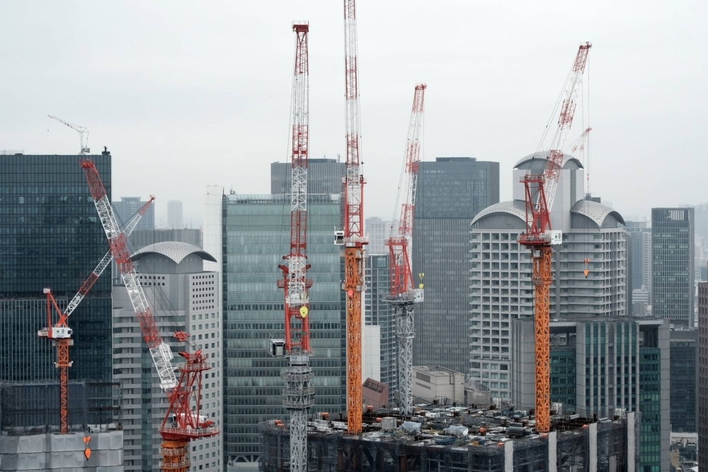 A building under construction in Osaka. Singapore investors are snapping up Japanese real estate, particularly in Osaka where a large casino resort is set to open.