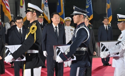 South Korean President Yoon Suk-yeol presides over a repatriation ceremony — receiving the remains of South Korean soldiers killed in the Korean War — on Wednesday, the day before the 70th anniversary of the Korean armistice, at Seoul Air Base in Seongnam, South Korea.