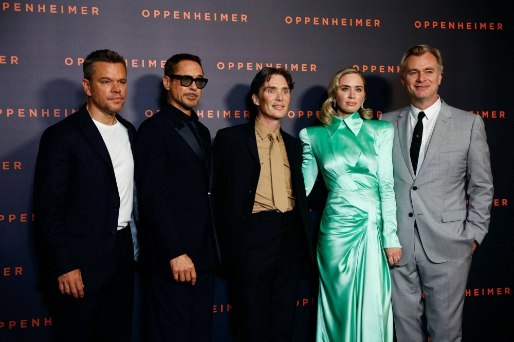 Director Christopher Nolan (right) poses with "Oppenheimer" cast members (from left) Matt Damon, Robert Downey Jr., Cillian Murphy and Emily Blunt at the film's premiere in Paris earlier this month. 