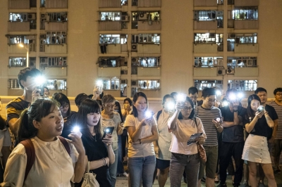 People sing songs, including "Glory to Hong Kong," during a demonstration in Hong Kong on Sept. 16, 2019. 